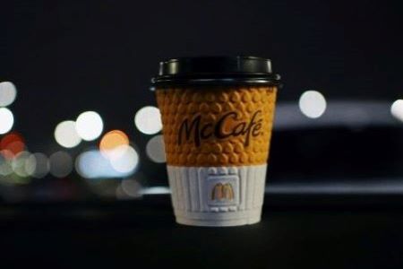 McDonald's coffee cup on car dashboard